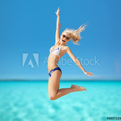 woman jumping on the beach