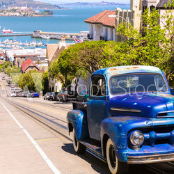 San Francisco Hyde Street and vintage car with Alcatraz
