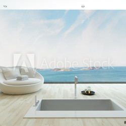 Modern floor bathtub against huge window with seascape view