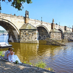 Wedding couple on the waterside of the Vltava River