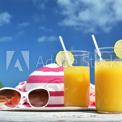 Sunglasses, hat and orange juice