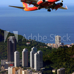 Airplane over Ipanema beach in Brazil